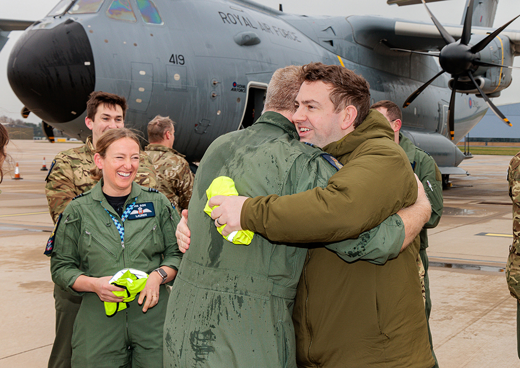 Hugs all around from fellow Squadron for Dunc.
